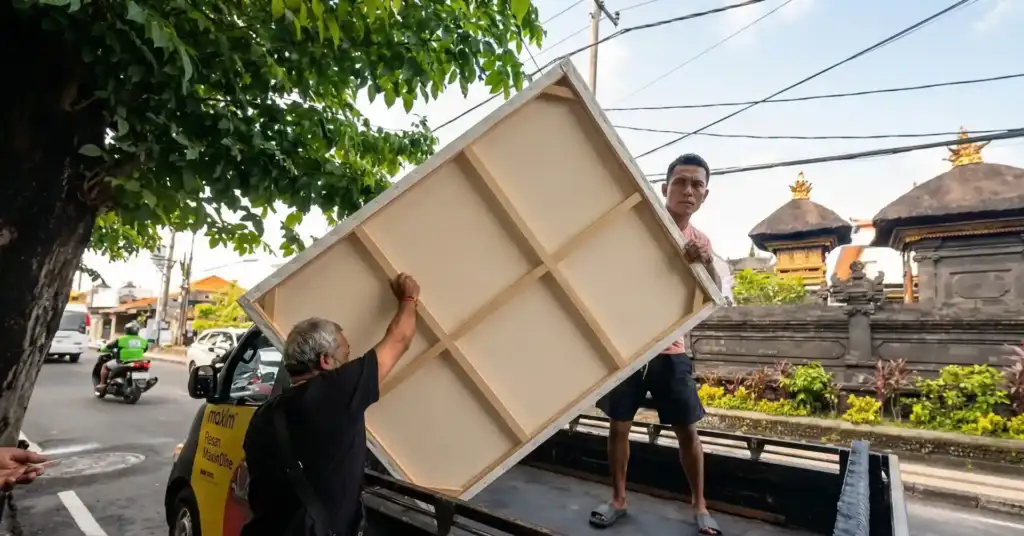 The Arts of Bali team safely delivering a large scale custom painting Bali to a customer villa