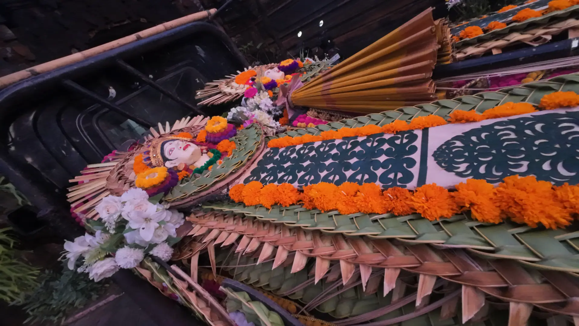 Intricate Balinese banten offerings crafted with local wisdom resting before a sacred wedding ceremony