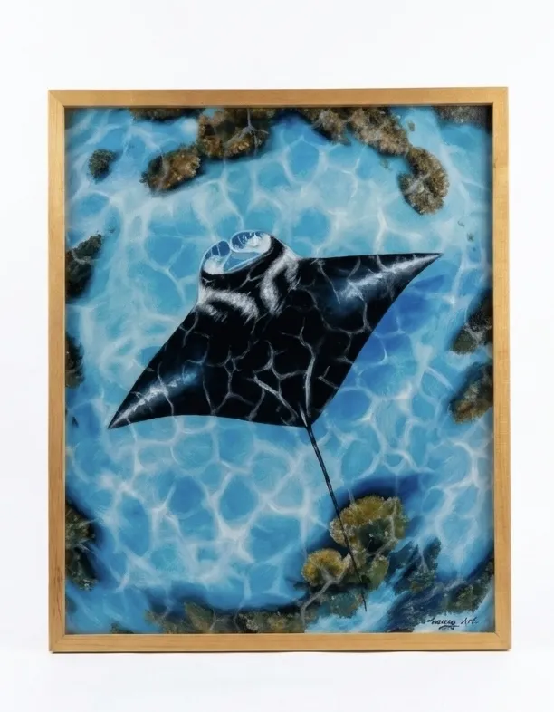 Manta ray painting Bali showing a large oceanic manta ray viewed from above, gliding over a coral reef in shallow blue water with light refraction patterns visible — original oil painting in gold frame at Arts of Bali gallery Seminyak