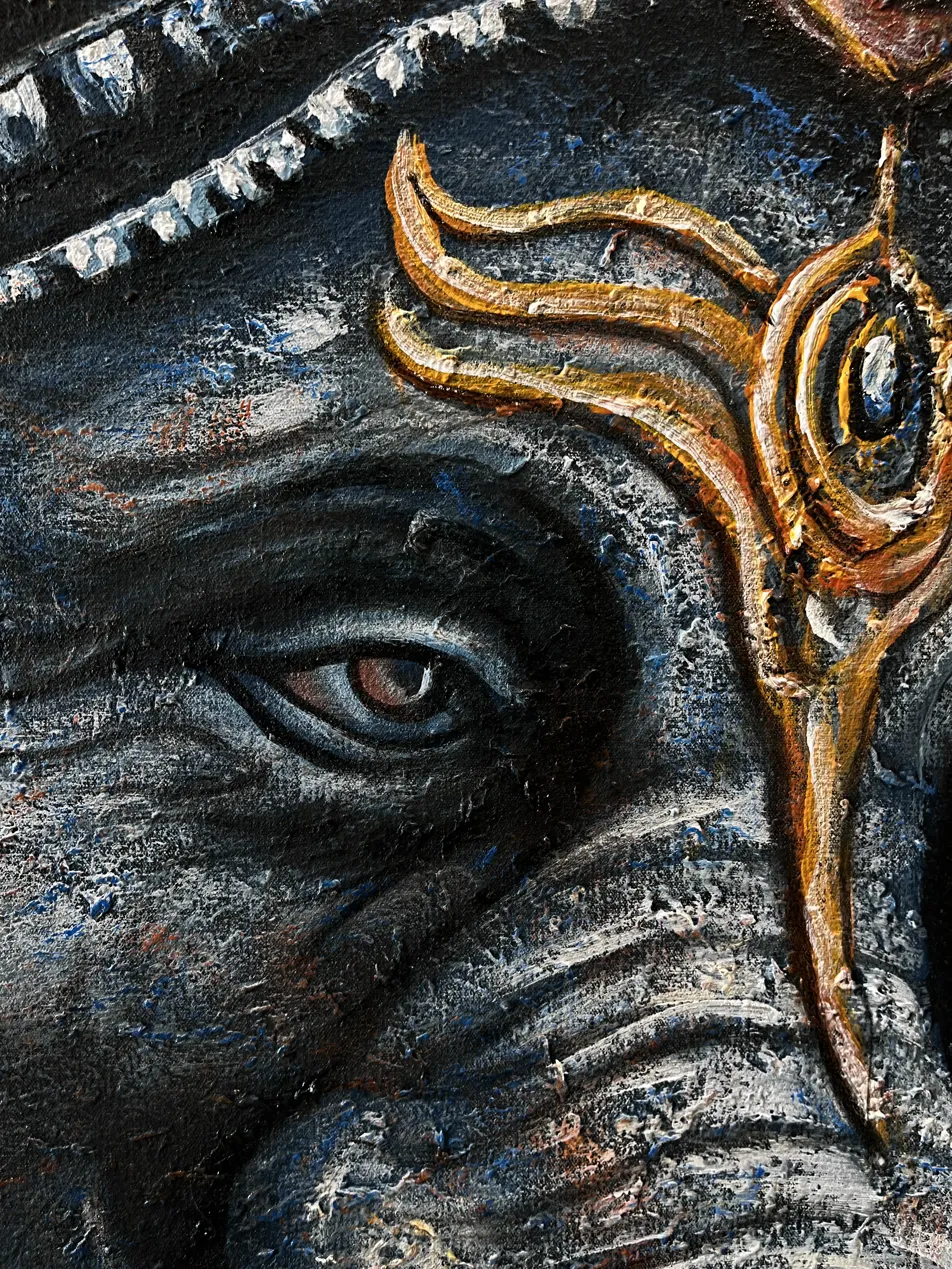 Textured Painting Bali — Ganesha Eye and Gold Detail Close-Up Macro close-up of textured painting Bali showing Ganesha eye and gold ornament detail with granular sand surface visible
