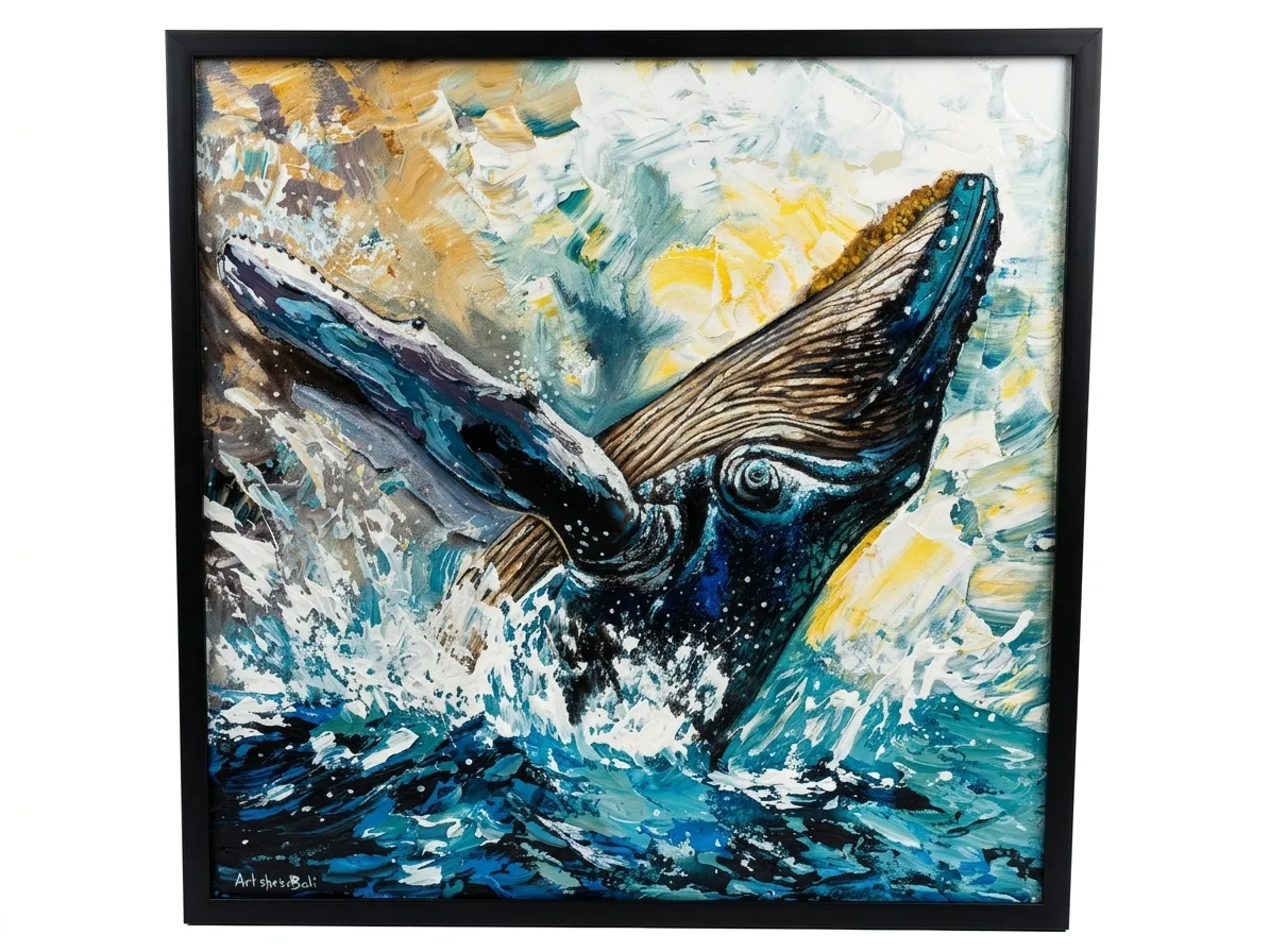 Humpback whale painting Bali showing a whale breaching from the ocean surface in dynamic palette knife oil technique, with splashing water and an abstract golden sky — original artwork in black frame at Arts of Bali gallery Seminyak