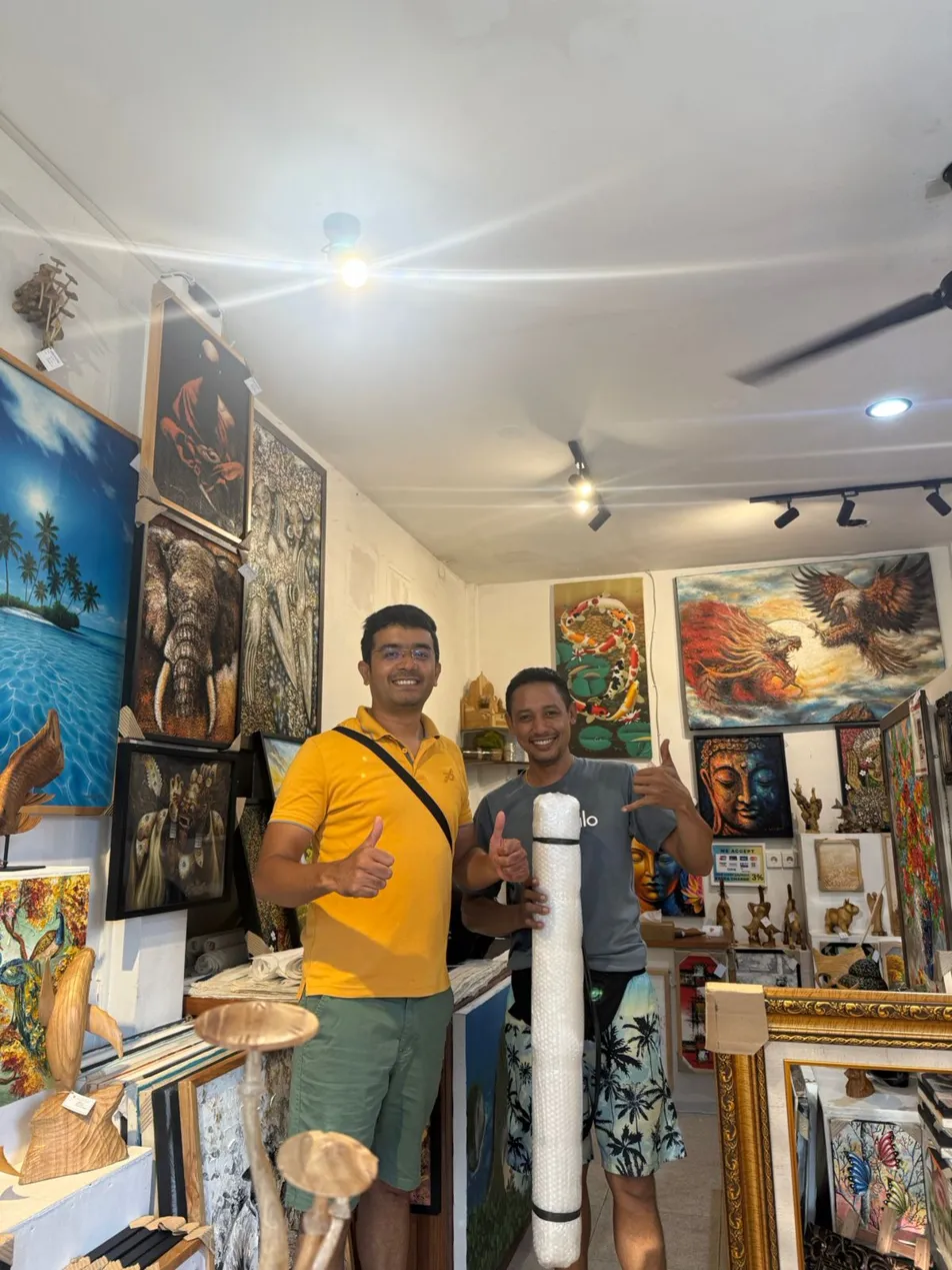 Collector from India picking up commissioned buy original painting bali order at Seminyak gallery