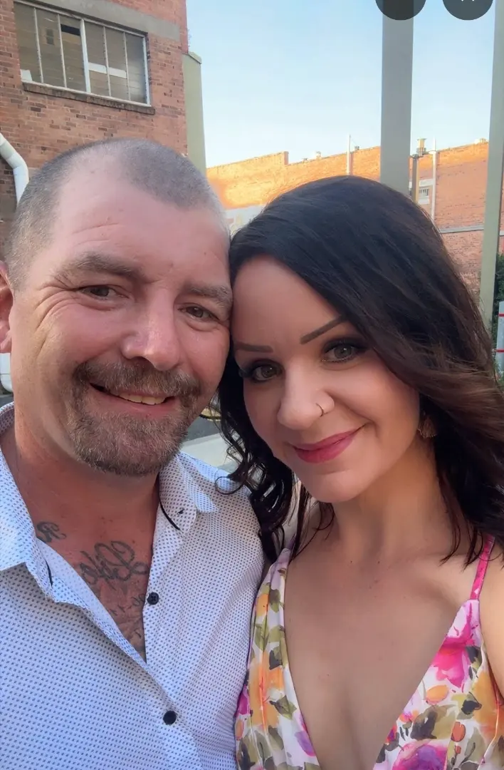 The original reference photograph of an Australian couple used to commission a custom portrait painting in Bali at Arts of Bali gallery in Seminyak