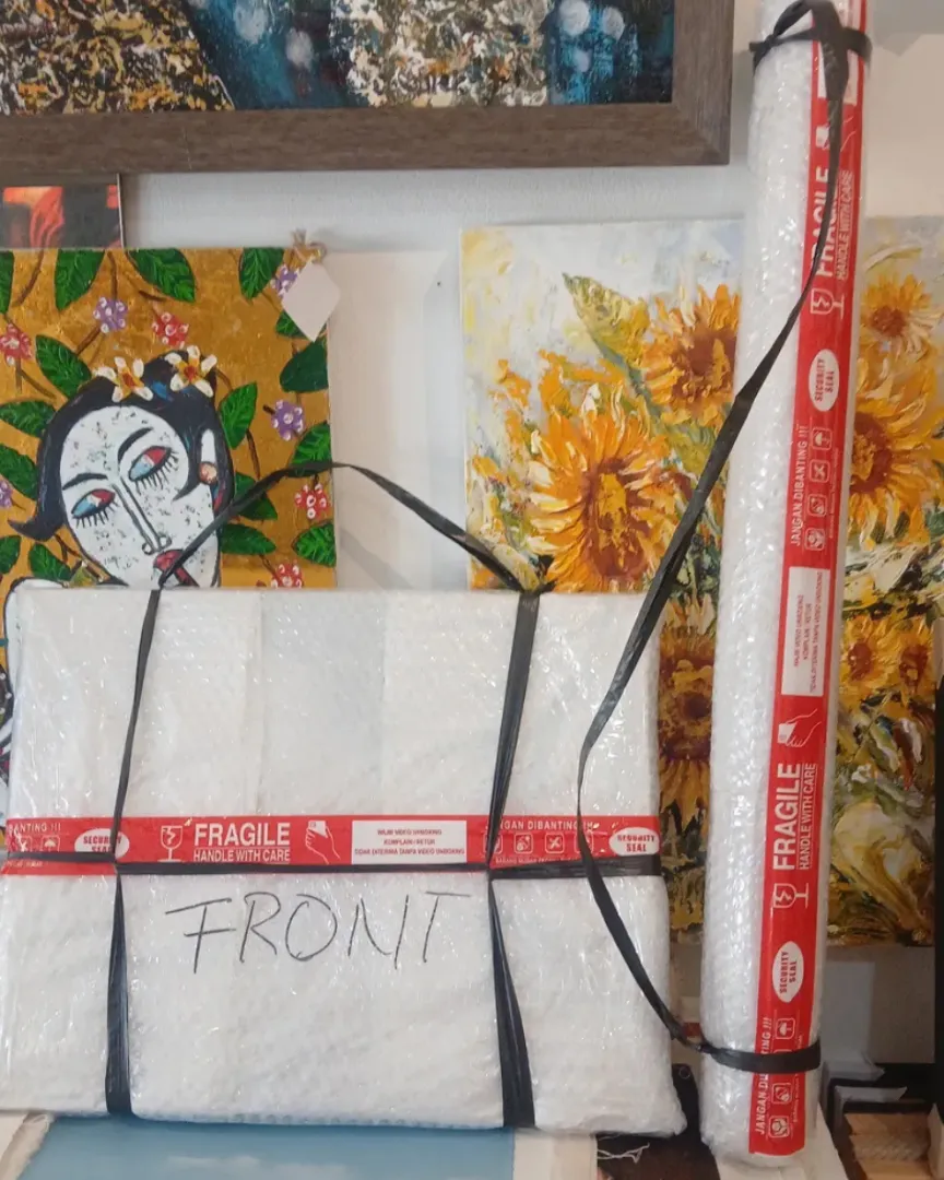 Ship painting from Bali international packaging — bubble wrap protective tube