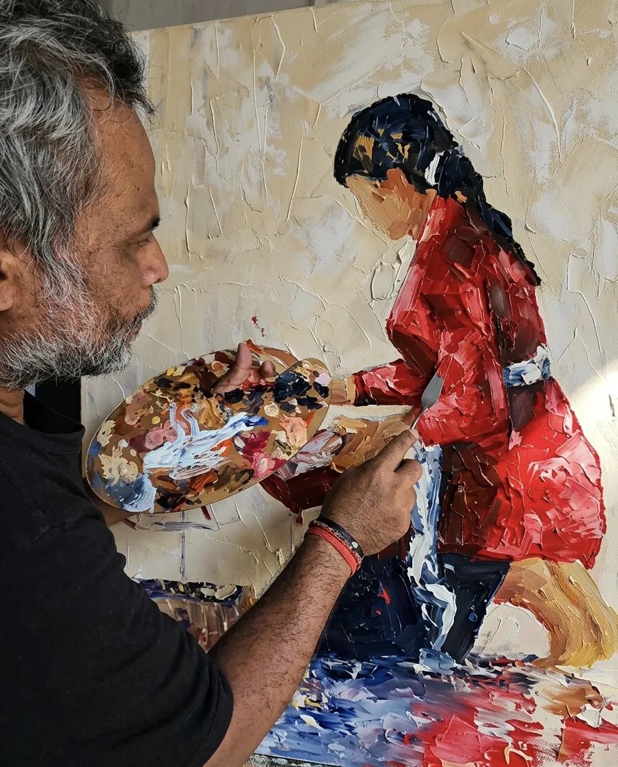 Upeksa, palette knife painting specialist at Arts of Bali Seminyak, applying thick oil paint to a large canvas using a palette knife to build textured layers