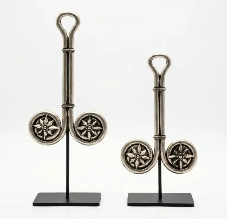 Home - Arts of Bali Pair of silver Balinese ceremonial objects with eight-pointed star medallions on black iron stands, sacred Indonesian metal art Arts of Bali