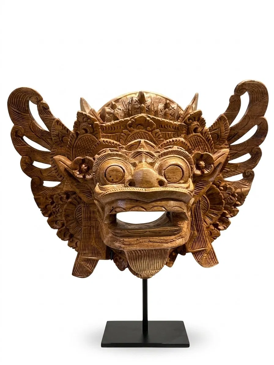Balinese wood carving mask: winged guardian face with bared fangs and carved wings, hero image, Arts of Bali Seminyak gallery