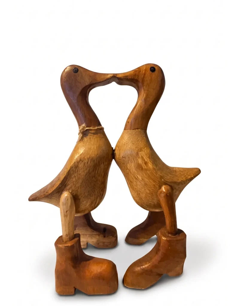 Pair of hand-carved wooden kissing ducks wearing boots touching beaks, Indonesian decorative art Arts of Bali Seminyak