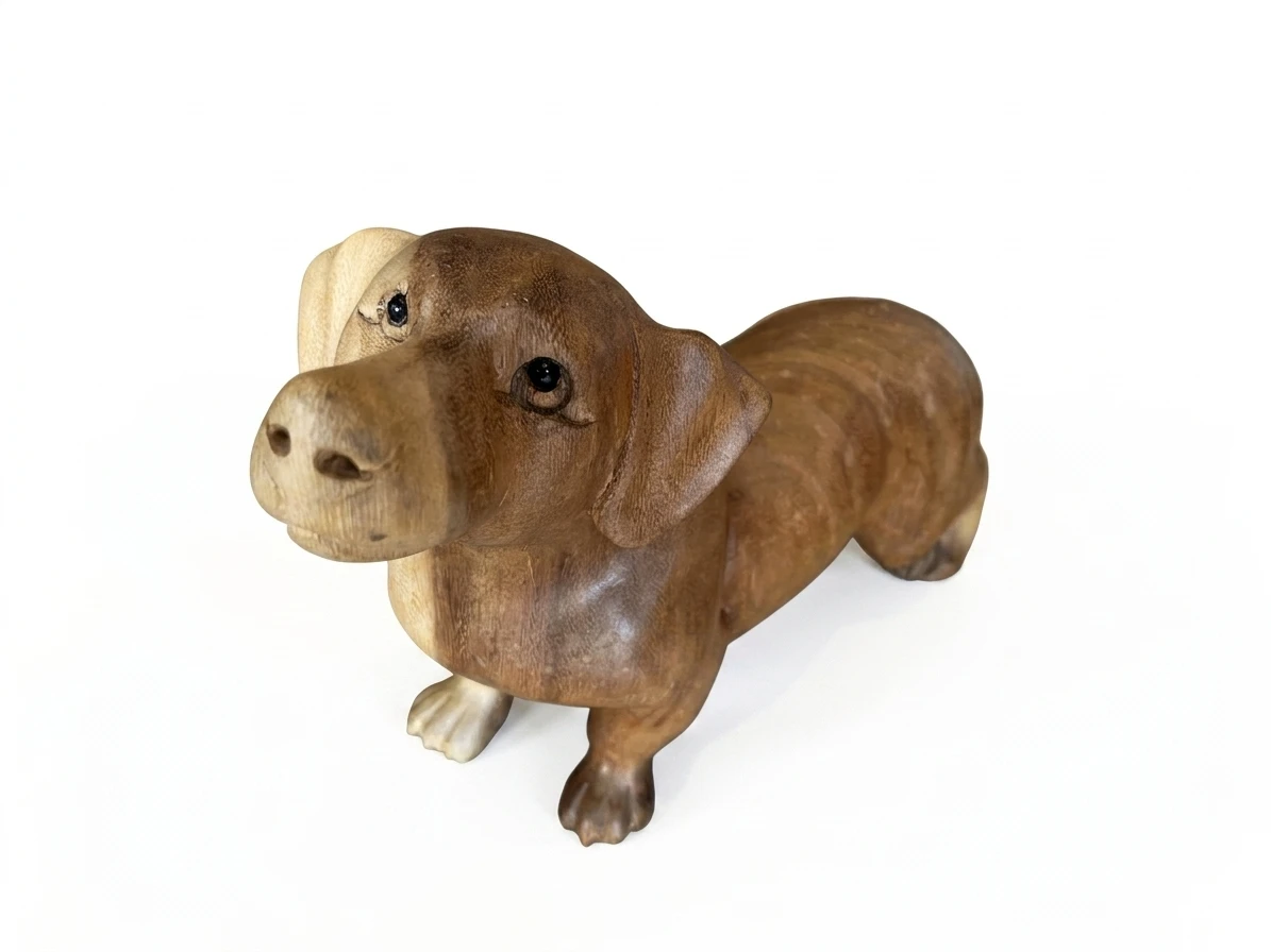 Hand-carved wooden Dachshund sculpture, two-tone wood finish with light muzzle and paws, standing pose — Arts of Bali gallery Seminyak