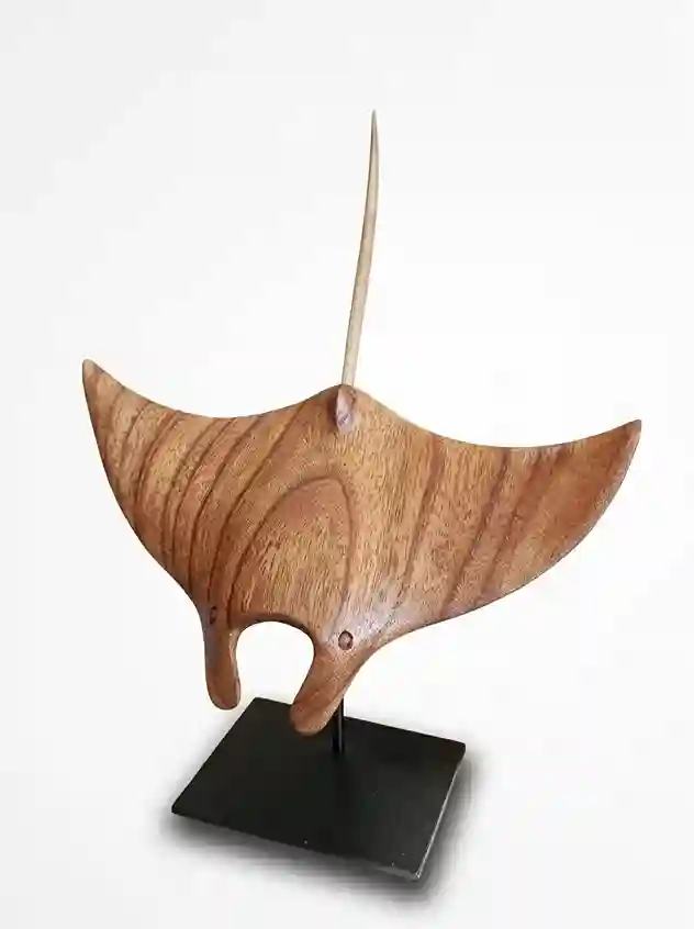 Authentic handcrafted oceanic manta ray figurine in warm polished wood from Arts of Bali.
