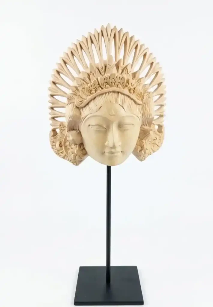 Hand-carved pale wood Balinese Janger dancer head bust with intricate floral crown on stand from Arts of Bali.